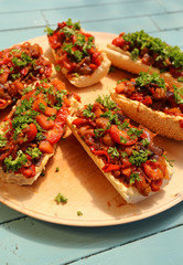Baguette with roasted vegetables and hummus