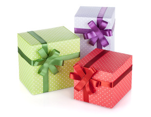 Three colorful gift boxes with ribbon and bow