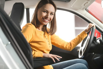 Join me for a drive. Attractive young woman sitting at the front