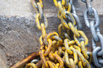 Chains against a concrete wall