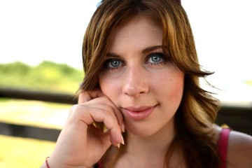 Pretty smiling girl relaxing outdoor