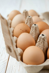 farm fresh eggs in a cardboard tray