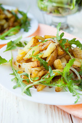 Roasted potatoes with arugula