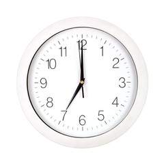 Clock face showing seven o'clock