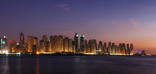 Fototapeta premium A dusk view of Dubai Marina including JBR from the Arabian Gulf