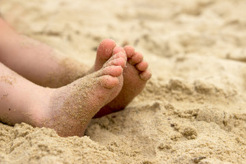 Baby's feet in the sand