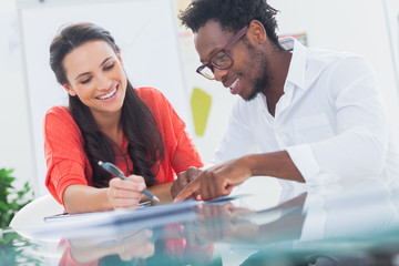 Smiling designers working at their desk