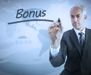 Businessman writing the word bonus