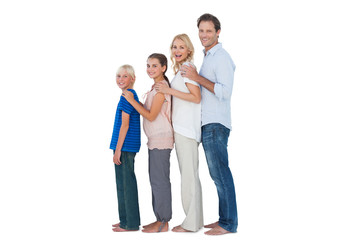 Family posing together and looking at camera
