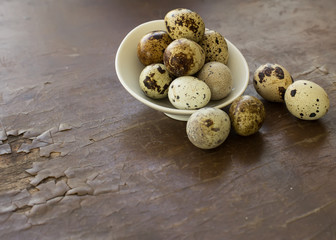 Quail eggs on wooden background