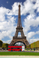 Eiffel Tower with red bus in Paris, France
