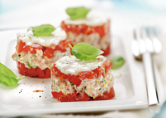 little tart made of shrimps with tomato.