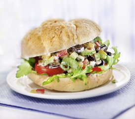 sandwich with salad served on a plate
