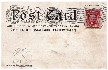 empty vintage postcard with postmark and stamp