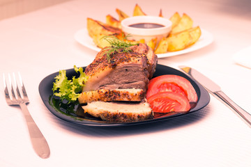 Baked Meat with Grilled Potato on white table