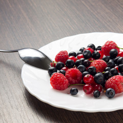 Frsh Berries in White Saucer with Spoon