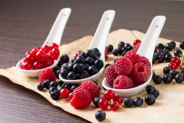 Fresh beriies in ceramic spoons