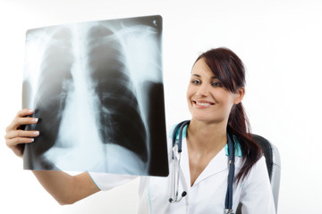 Female doctor examining an x-ray image. Focus on face