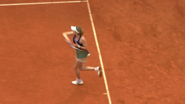 Girl play tennis outdoor on orange clay tennis court