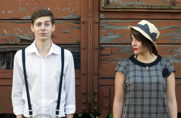 Retro young love couple vintage funny face industrial setting