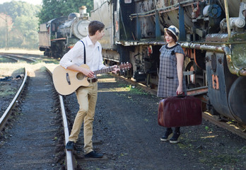 Retro young love couple vintage serenade train setting