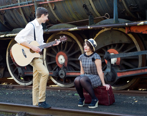 Retro young love couple vintage serenade train setting