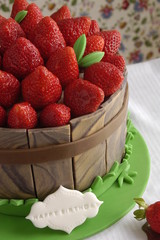 Cake decorated with fondant and fresh strawberries