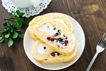 Sweet roll and fresh blueberry