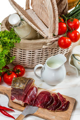 Basket full of fresh vegetables and ham