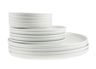 Pile of clean white dish plates isolated