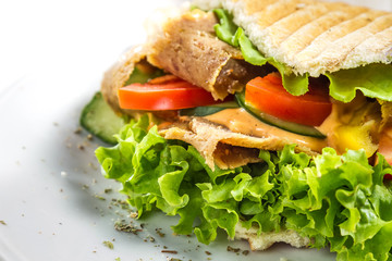 Kebab on a bun with vegetables and meat
