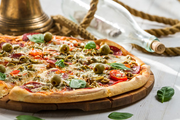 Closeup of fresh pizza on a boat