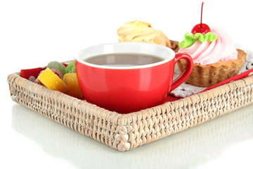 Cup of tea with cakes on wooden tray isolated on white