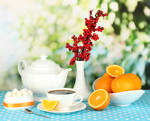 Beautiful white dinner service with oranges