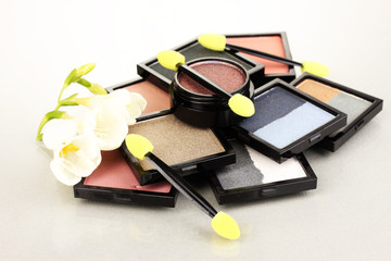 Bright eye shadows and sponge brushes for foundation