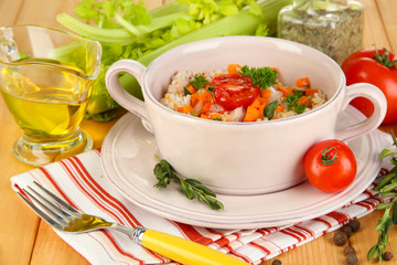 Delicious rice with vegetables and herbs in pot
