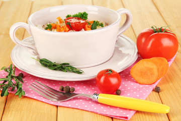 Delicious rice with vegetables and herbs in pot