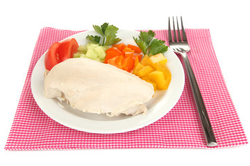 Boiled chicken breast on plate with vegetables isolated on