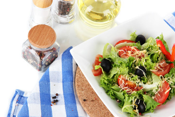 Light salad on plate on napkin