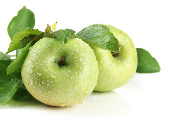 Juicy green apples with leaves, isolated on white