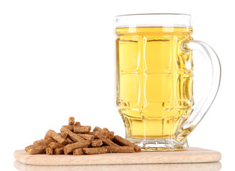 Beer in glass and croutons on on board isolated on white