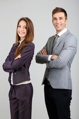 Successful business people on grey background
