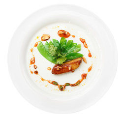 Fried foie gras with caramel and vegetables, isolated