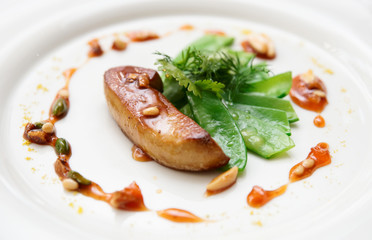 Fried foie gras with caramelized nuts and vegetables