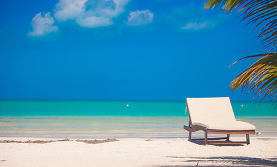 Beach lounger on the exotic resort on white sand beach