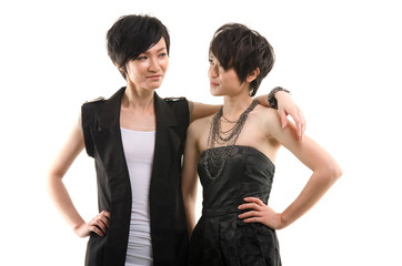 korean sisters in alternative k pop wear with isolated white bac