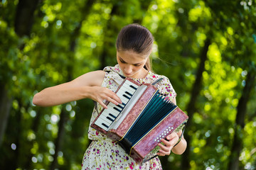  woman playing the accordion