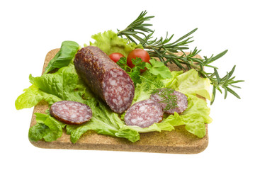 Salami with rosemary, salad and tomatoes