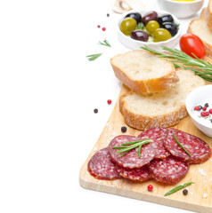 Fototapeta na wymiar antipasto - salami, bread, olives, tomatoes isolated on white