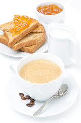 cup of cappuccino, milk and fresh toast with jam on white